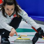 Italy's Stefania Constantini delivering a curling stone during World Women's Curling Championship match against Sweden