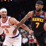 Nickeil Alexander-Walker drives to the basket against Josh Hart during NBA game between Atlanta Hawks and New York Knicks