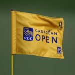 Pin flag fluttering on the green at the RBC Canadian Open golf course on a sunny day